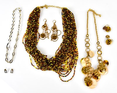 Lot 856 - GIVENCHY; a silver and gold tone necklace and...