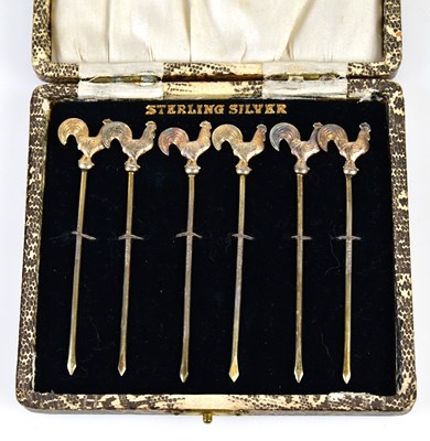 Lot 2757 - A cased set of six sterling silver gilt...