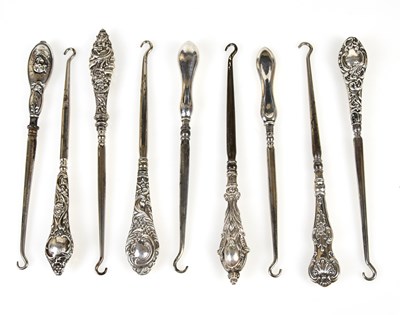 Lot 2492 - Nine hallmarked silver handled button hooks,...