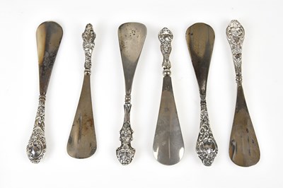Lot 2493 - Six hallmarked silver handled shoe horns, with...