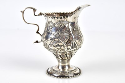 Lot 2104 - A George III hallmarked silver pedestal jug...