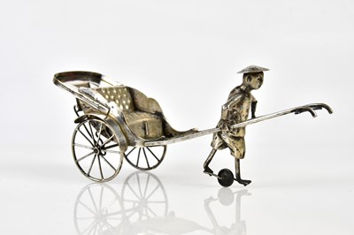 Lot 2797 - A Chinese silver plated model of a figure...