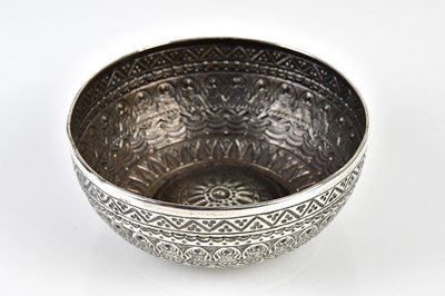 Lot 2143 - An Indian white metal bowl with embossed...