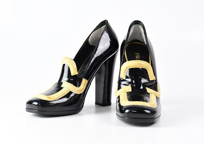 Lot 1072 - PRADA; a pair of vintage patent black and...