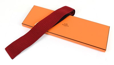 Lot 809 - HERMÈS; a 100% wool Bordeaux and red...