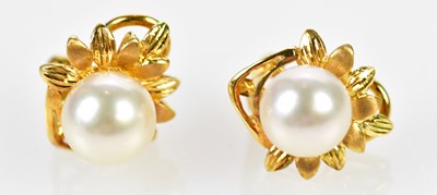 Lot 671 - A pair of yellow metal pearl set clip on...