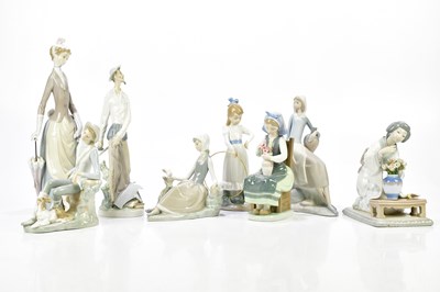 Lot 1246 - LLADRO; a collection of six figures including...