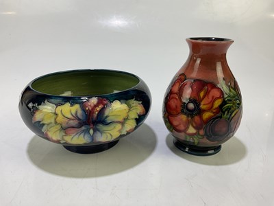 Lot 5509 - MOORCROFT; a baluster vase decorated in the...