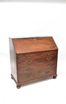Lot 48 - A George III mahogany bureau, the fall front...