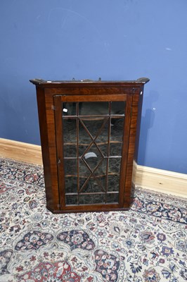 Lot 6654 - A 19th century mahogany hanging corner cabinet...