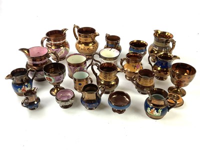 Lot 5482 - A collection of 19th century lustre jugs and...