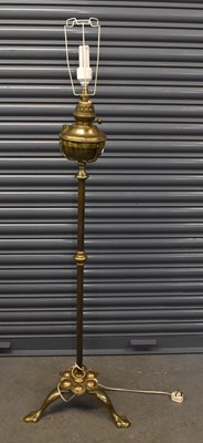 Lot 129 - An early 20th century brass standard oil lamp...