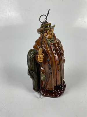 Lot 5359 - ROYAL DOULTON; a Kingsware figural flask 'Tony...