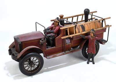 Lot 24 - A modern carved wood, metal and composite...