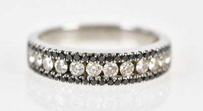 Lot 80 - An 18ct white gold diamond and black diamond...