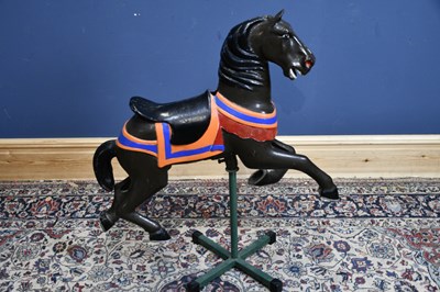 Lot 6458 - A vintage painted metal carousel horse,...