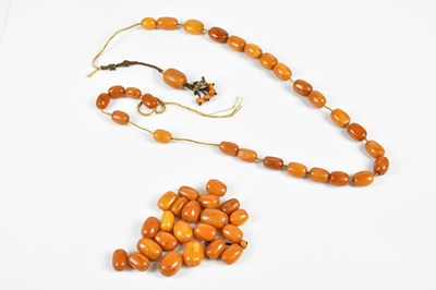 Lot 361 - An amber coloured bead necklace (string has...