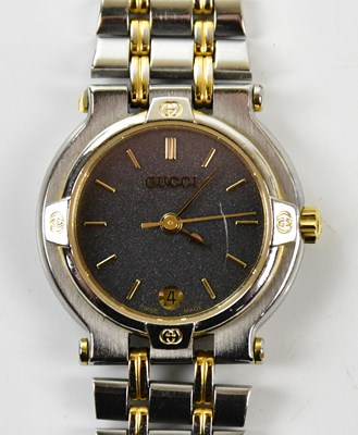 Lot 829 - GUCCI; a vintage 9000L stainless steel and...