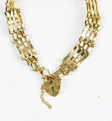 Lot 308 - A 9ct yellow gold four bar gate link bracelet,...
