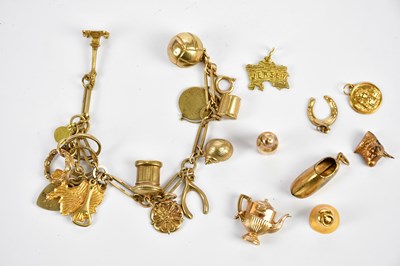 Lot 278 - A 9ct yellow gold charm bracelet with a number...
