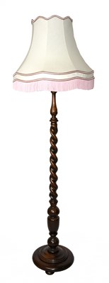 Lot 1613 - A 1920s oak standard lamp, with spiral turned...