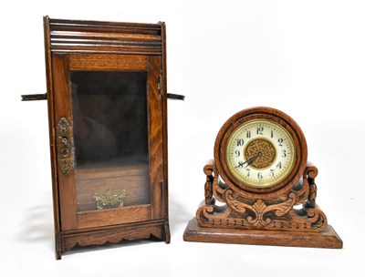 Lot 1377 - A Victorian carved oak mantel time piece,...