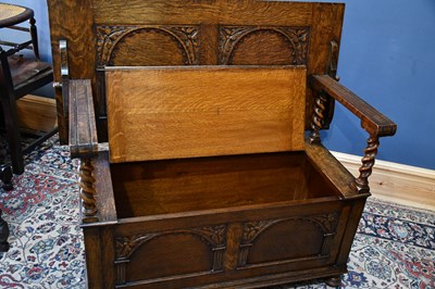 Lot 5 - A 1920s carved oak monk's bench, height 100cm,...