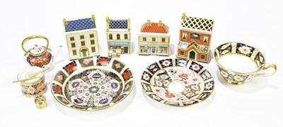 Lot 1267 - ROYAL CROWN DERBY; a group of four houses to...