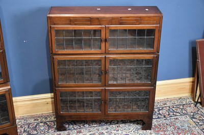 Lot 6667 - MINTY; a mahogany three tier bookcase with...