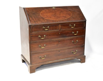 Lot 81 - A George III mahogany bureau, the fall front...