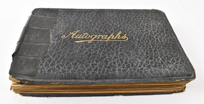 Lot 410 - A leather bound autograph book containing...