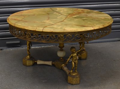 Lot 55 - A gilt metal and onyx topped coffee table with...