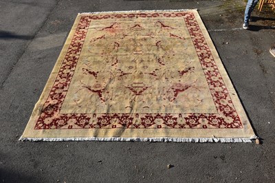 Lot 6481 - A large Chinese cream ground carpet with...