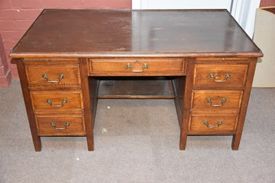 Lot 6739 - An early 20th century oak seven drawer...