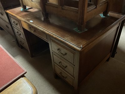 Lot 6740 - A 1920s oak four drawer desk, length 114cm,...