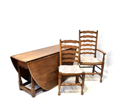 Lot 82 - A large Georgian drop-leaf gateleg dining...
