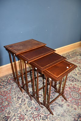 Lot 6741 - A nest of four reproduction inlaid mahogany...
