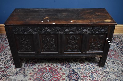 Lot 6522 - An 18th century oak coffer with carved and...