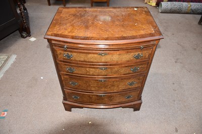 Lot 6737 - A 1950s burr walnut veneered bow front chest...