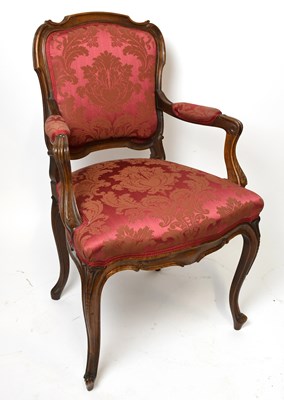 Lot 1649 - A French carved and stained beech Louis XV...
