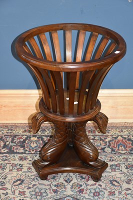 Lot 6756 - A reproduction circular jardinière on stylised...