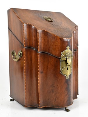Lot 7 - A George III inlaid mahogany serpentine shaped...
