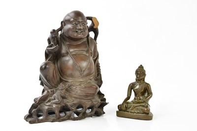 Lot 5318 - A Tibetan bronze model of seated Buddha,...
