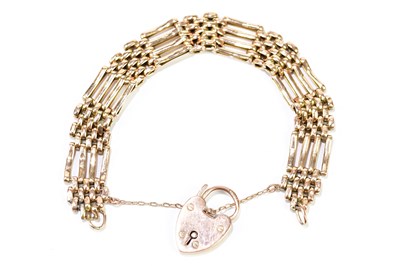 Lot 1127 - A 9ct yellow gold gate link bracelet with...