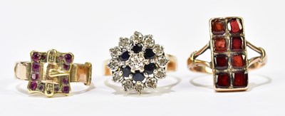 Lot 1141 - A 9ct yellow gold garnet set dress ring, size...