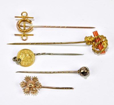 Lot 1166 - A Victorian yellow metal stick pin set with a...