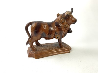 Lot 1256 - An unusual treacle glazed ceramic model of a...