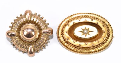 Lot 1467 - Two Victorian yellow metal brooches, the oval...
