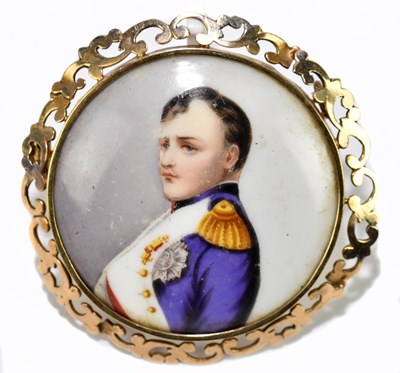 Lot 1425 - A circular yellow metal framed porcelain...