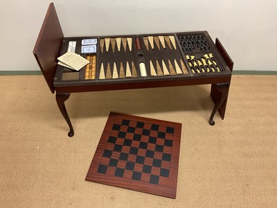 Lot 540 - A coffee table containing chess and backgammon...
